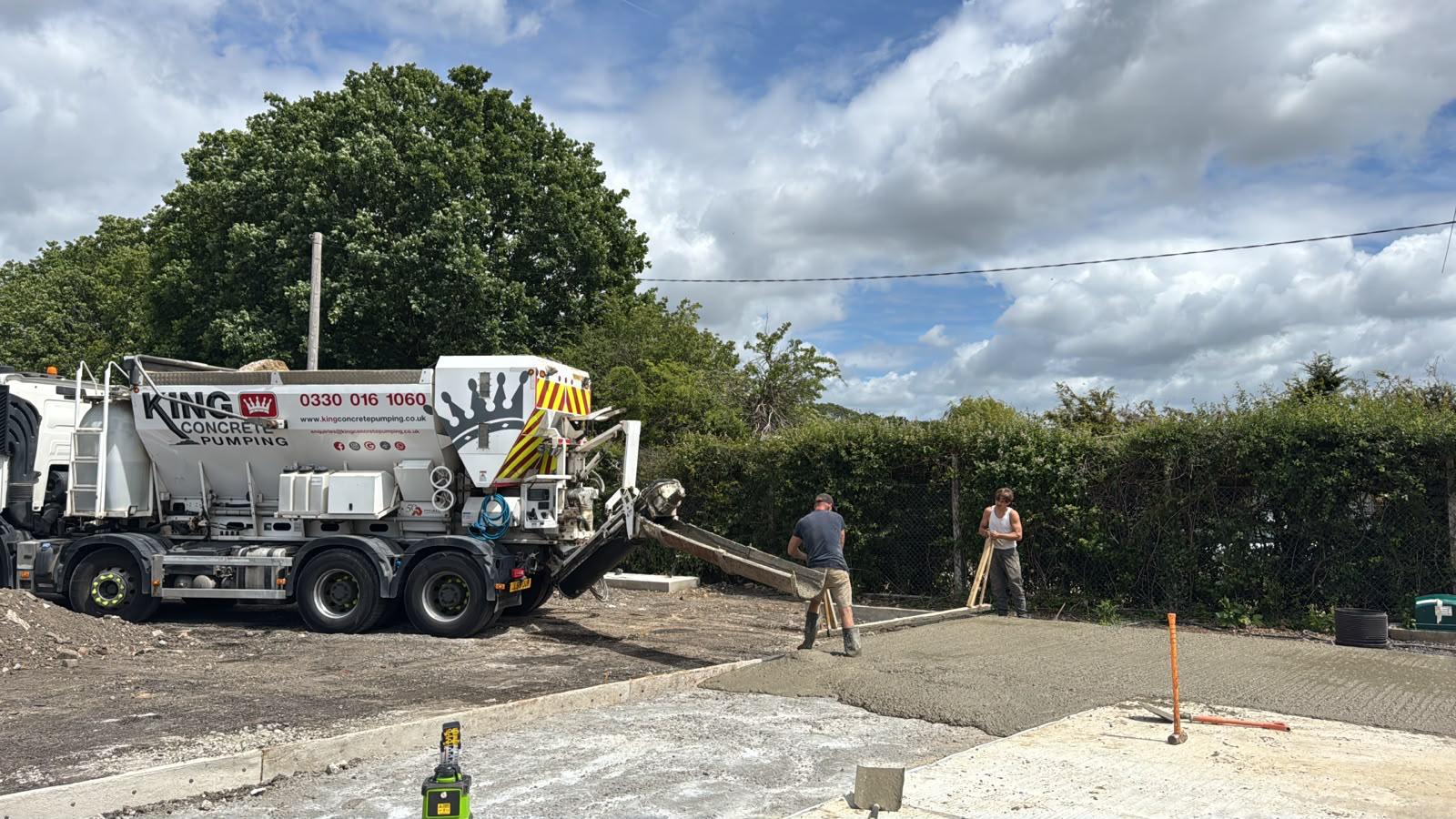 King Concrete Pumping crew placing concrete on a Caterham site